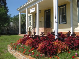 Side view of City Hall with flowers